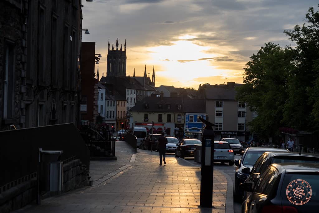 sunset in kilkenny ireland with street and castle in background