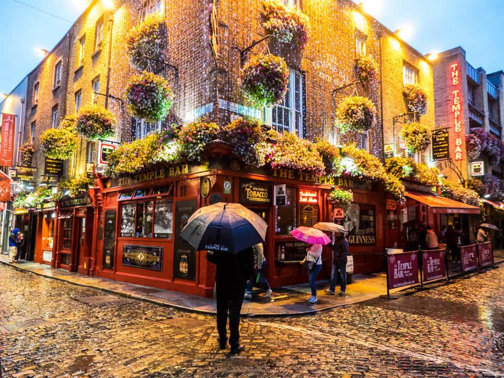 rainy evening in front of temple bar in dublin ireland with umbrella