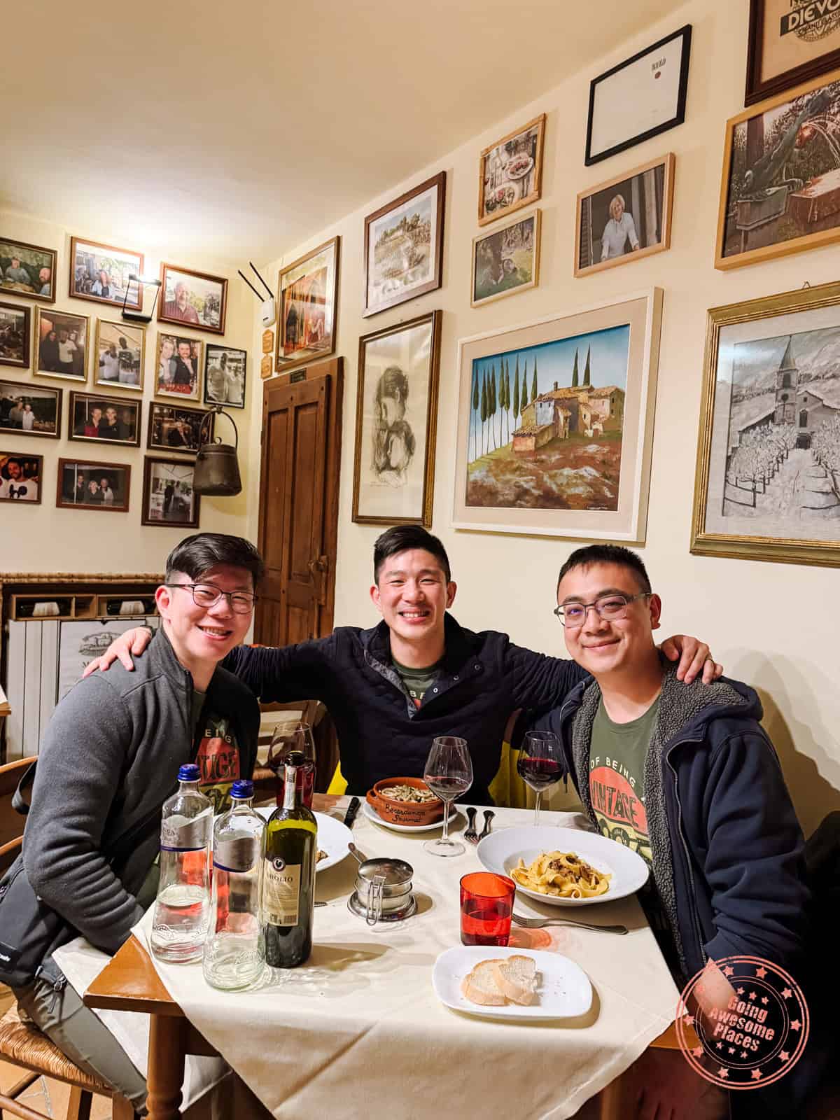 3 asian guys eating at ristorante la grotta della rana