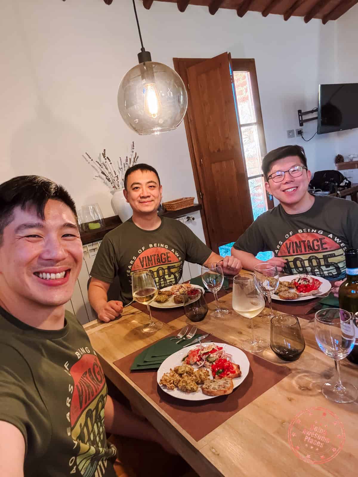 3 asian guys in italian cooking class in villa