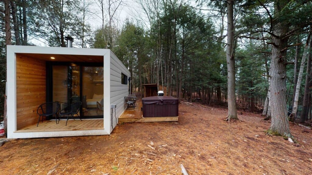 aux box muskoka exterior with hot tub airbnb