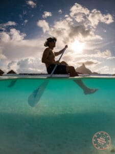 bora bora paddle boarding half underwater
