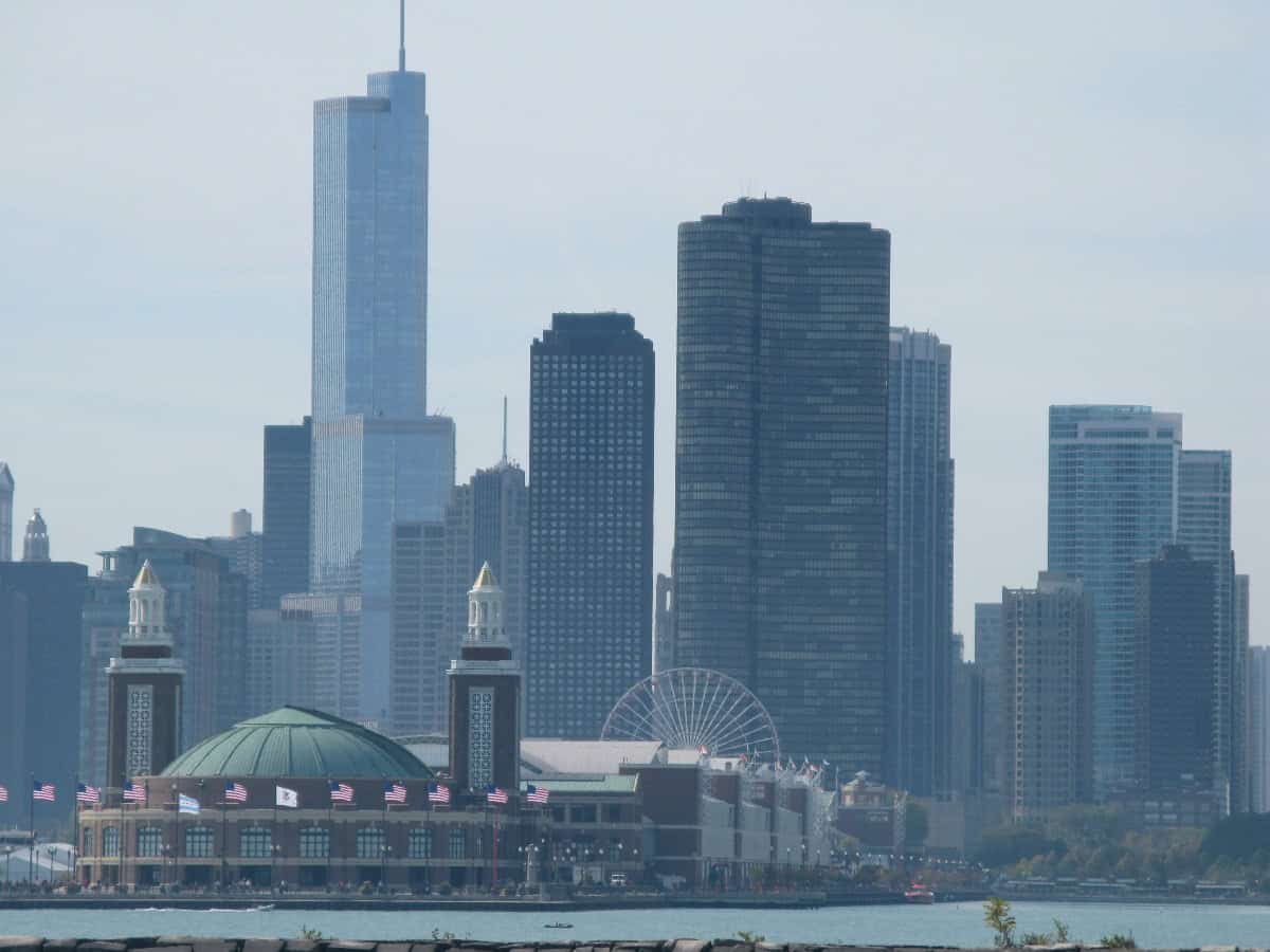 distant view of navy pier in front of chicago city