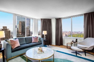 conrad new york midtown living quarters with floor to ceiling windows/drapes