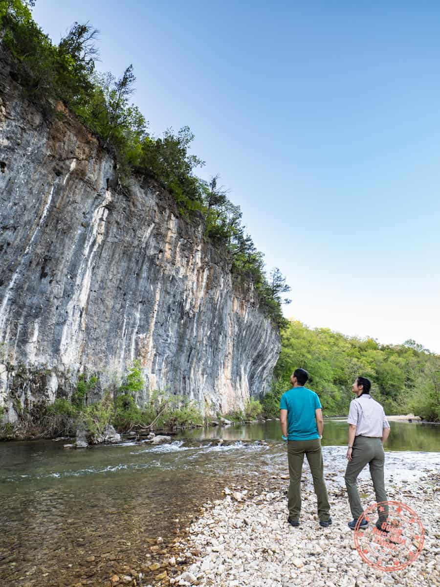 couple standing by echo bluff rock formation in missouri