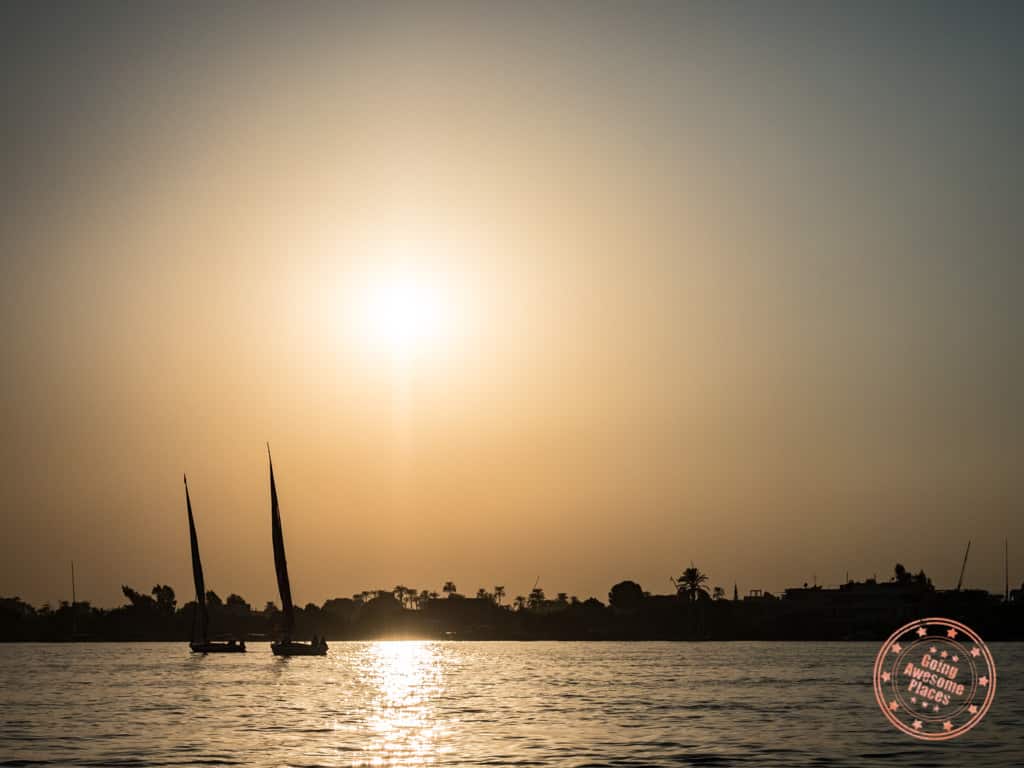 felluca sailing in luxor egypt at sunset