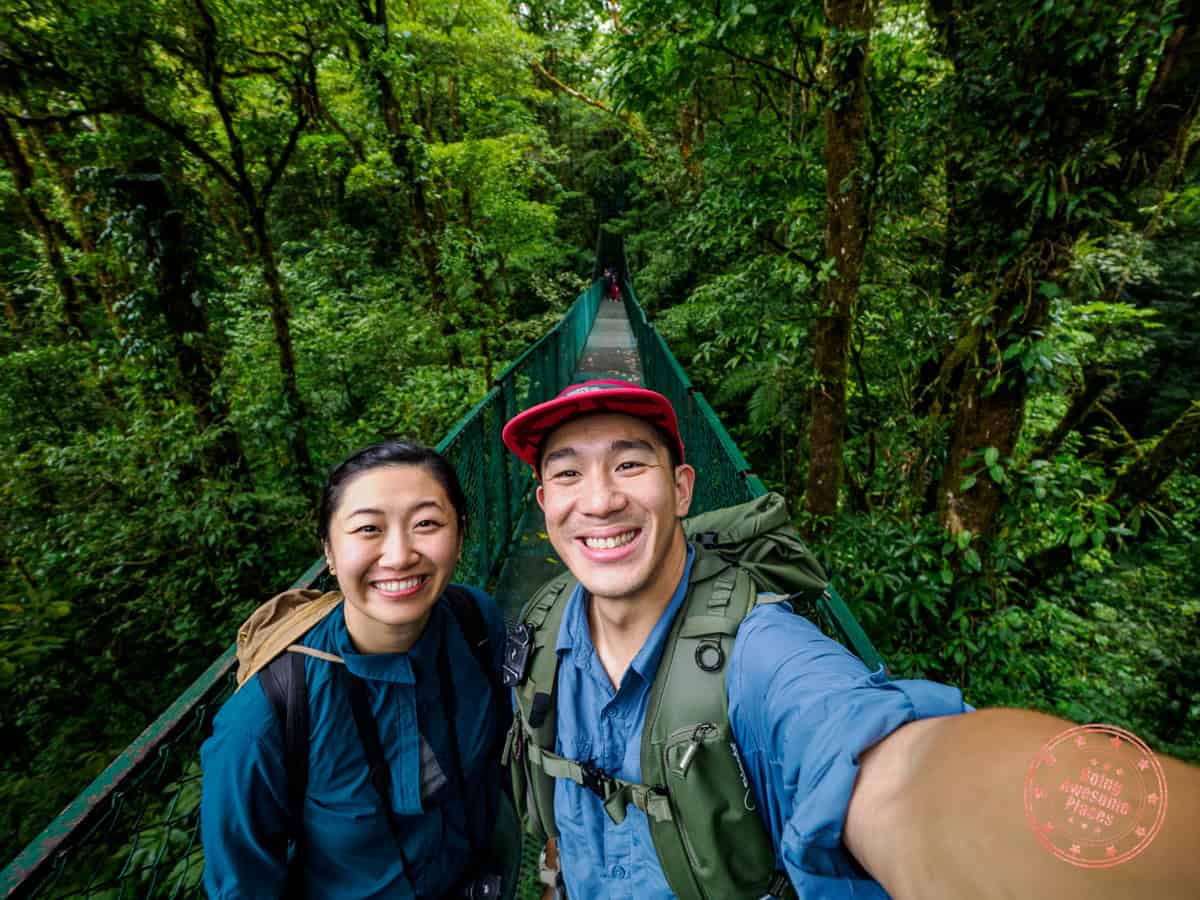 going awesome places couple selfie in monteverde cloud forest bridge