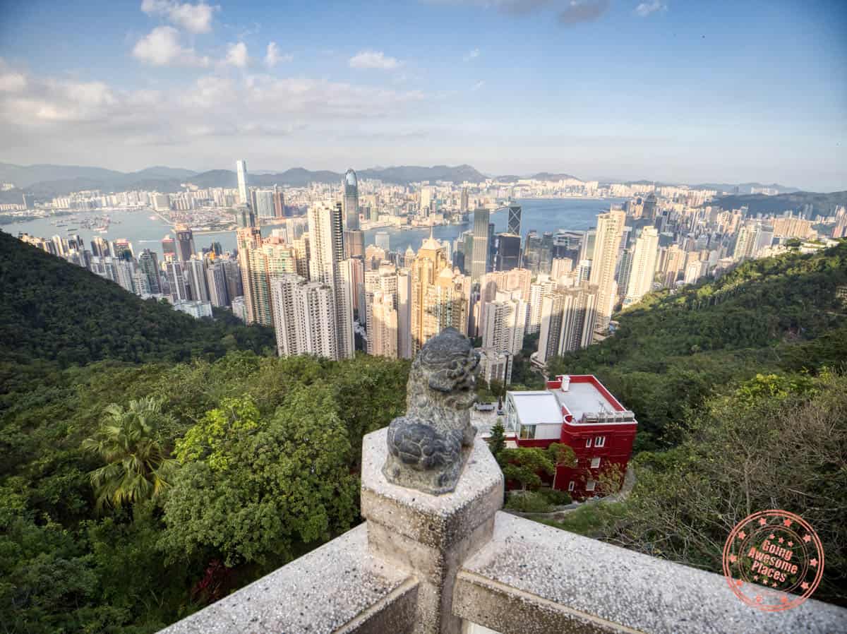 hong kong victoria peak view of the skyline centered by a lion statue