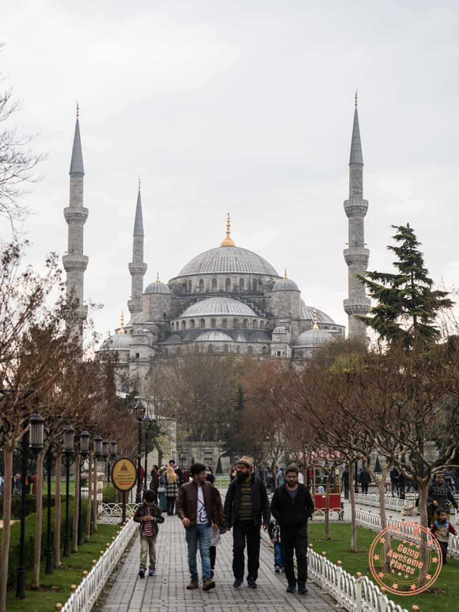 walkway in sultan ahmet square with blue mosque in the background