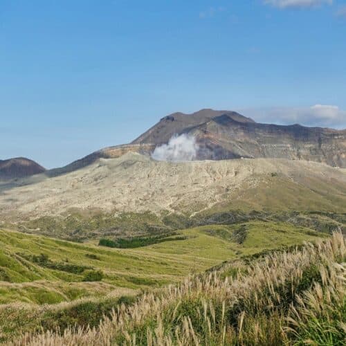 stunning view of mt. aso from across grasslands
