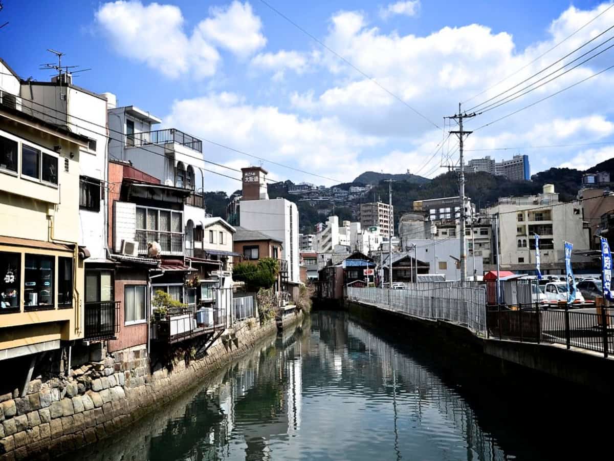 town in nagasaki with stream running through