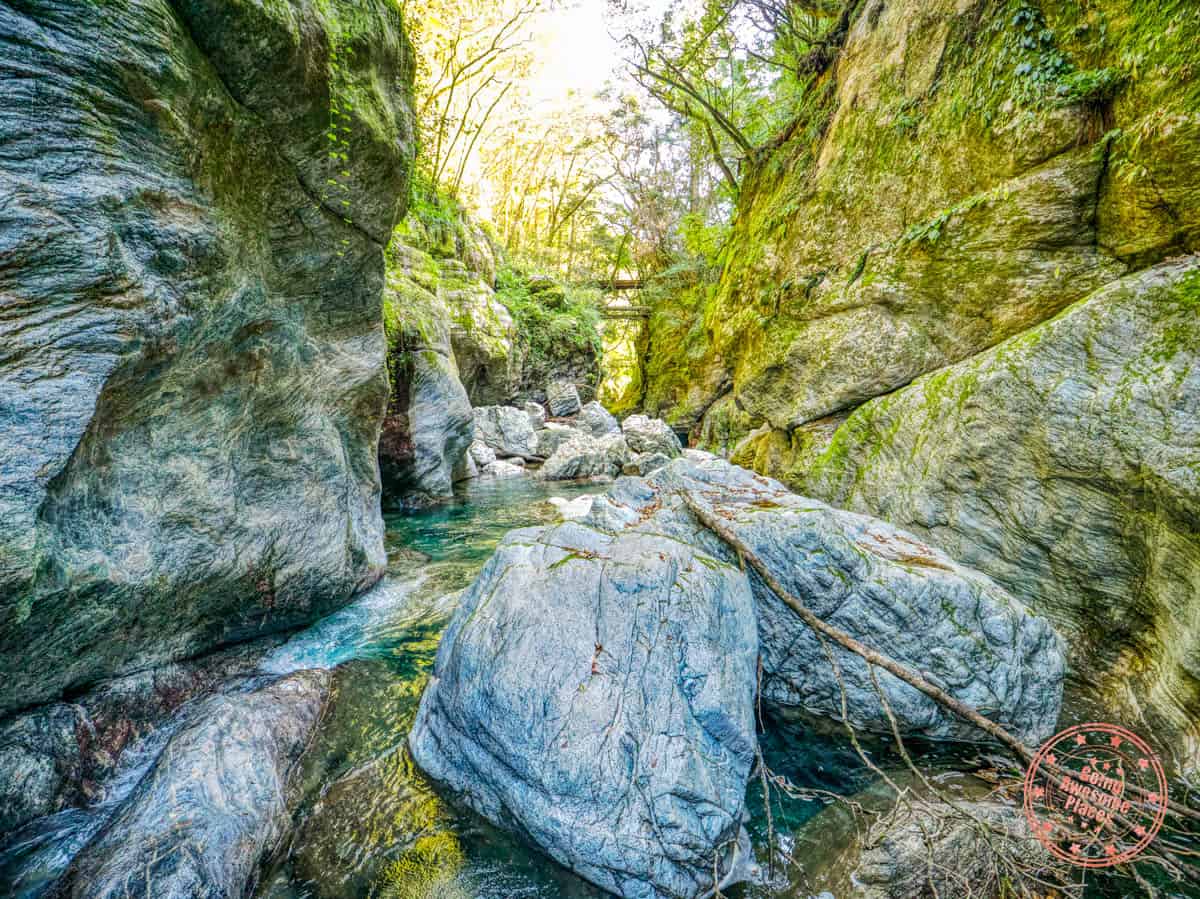 nakatsu gorge view of dramatic rocks bridge and water during canyoning excursion