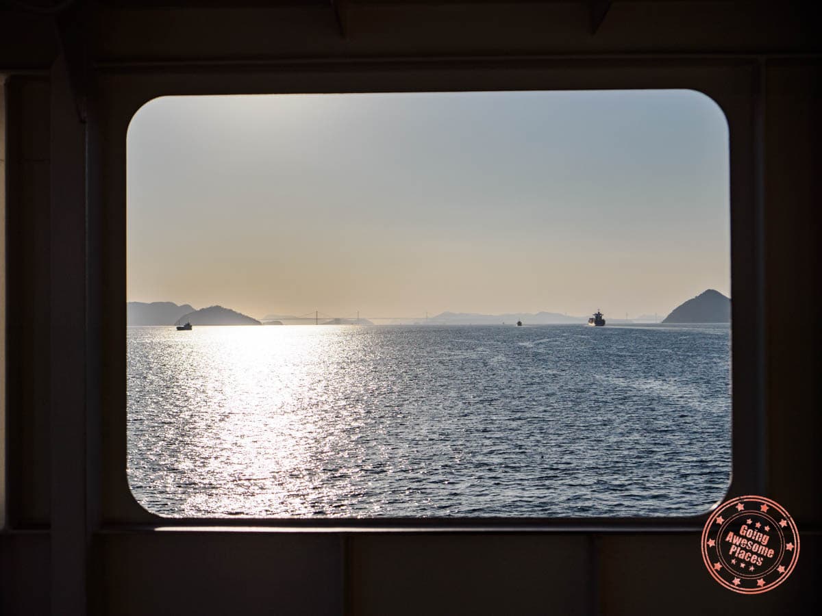 port window view of great seto bridge on ferry from takamatsu to naoshima