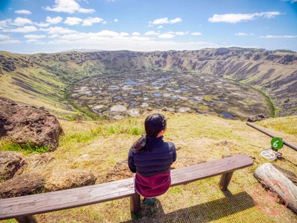 woman looking out into rano kau crater from orongo on easter island