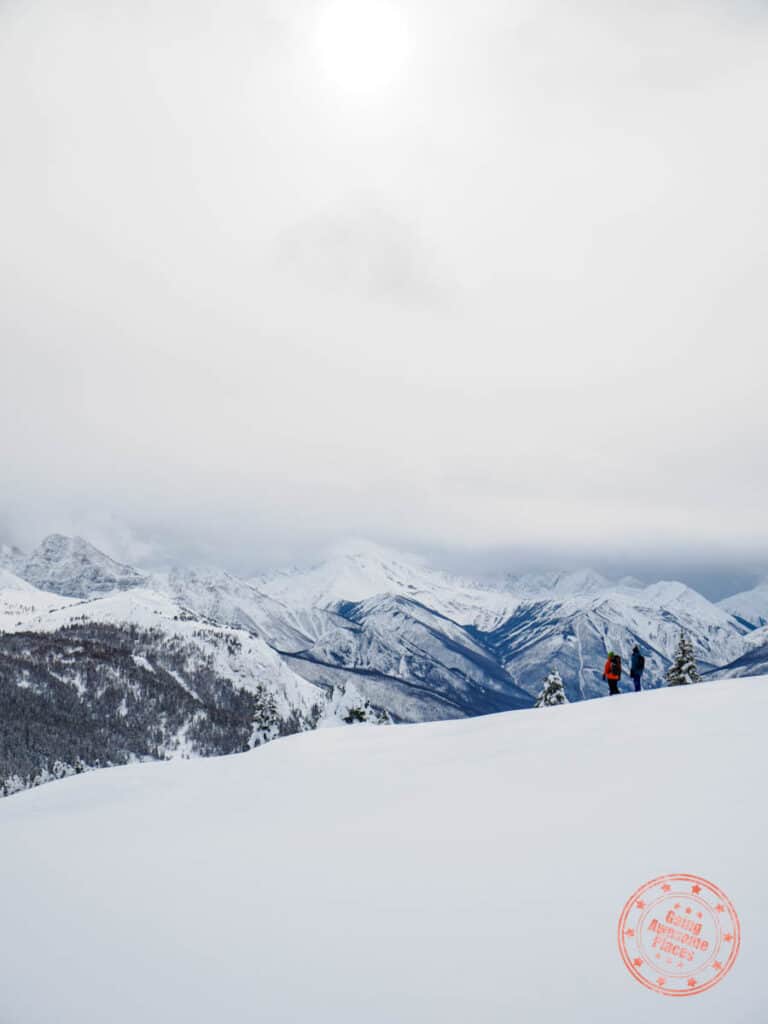 snowshoeing activity for banff in winter surrounded by mountains