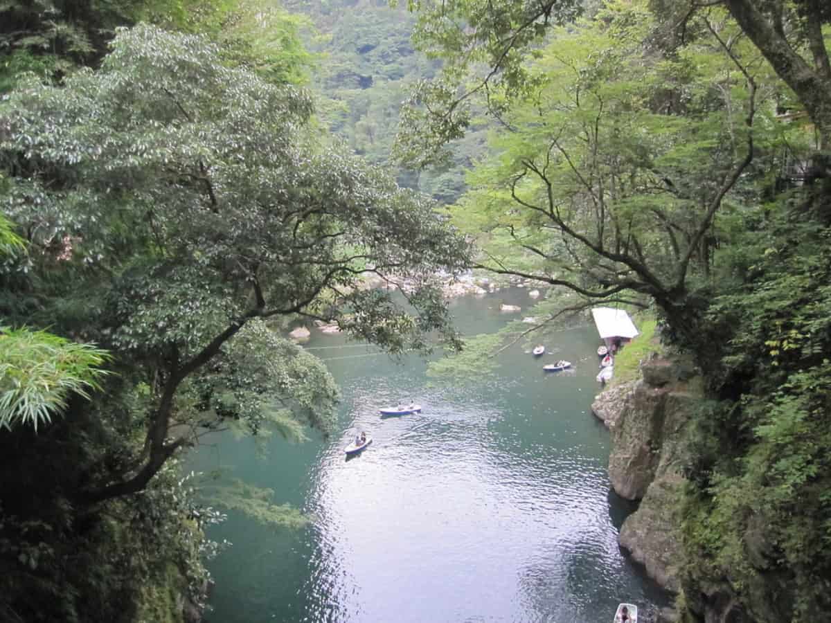 tourists boating down the takachiho gorge 