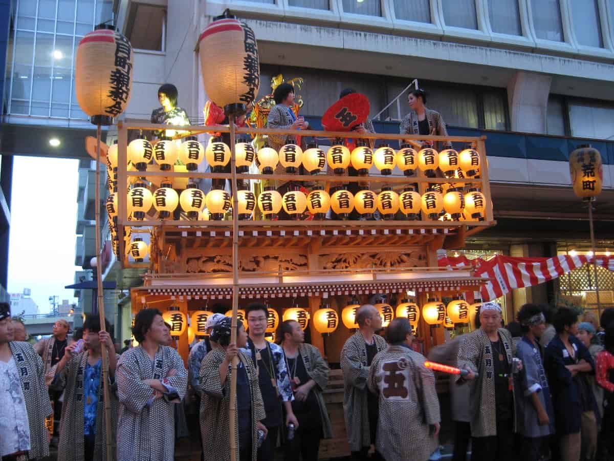 crowd lining the streets for a festival in tohoku