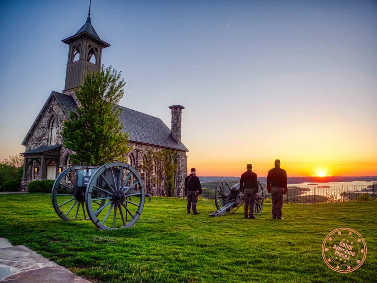 civil war soldiers standing beside cannon at top of the rock sunset ceremony