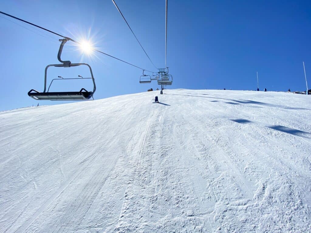 weekend trips from pittsburgh to ski resort chair lift ascending a mountain