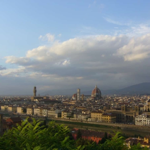 view of florence skyline from afar beneath cloudy sky